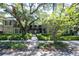 Building exterior showing a courtyard entrance with manicured hedges at 1008 S Moody Ave # 6, Tampa, FL 33629