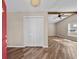 Spacious living room with wood-look tile floors and a ceiling fan at 11001 Hobson St, Spring Hill, FL 34608