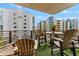 Private balcony with patio furniture and city views at 1208 E Kennedy Blvd # 410, Tampa, FL 33602