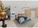 Bright and airy main bedroom with a large bed and elegant chandelier at 1208 E Kennedy Blvd # 410, Tampa, FL 33602