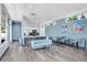 Community room with kitchen, seating area, and large windows at 1208 E Kennedy Blvd # 410, Tampa, FL 33602