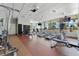 Well-equipped fitness center with treadmills, weight machines, and large windows at 1208 E Kennedy Blvd # 410, Tampa, FL 33602