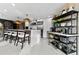 Modern kitchen with island, stainless steel appliances and open shelving at 1208 E Kennedy Blvd # 410, Tampa, FL 33602