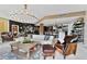 Open concept living room with kitchen, stylish furniture, and large chandelier at 1208 E Kennedy Blvd # 410, Tampa, FL 33602