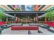 Outdoor lounge with fire pit, comfortable seating, and covered bar at 1208 E Kennedy Blvd # 410, Tampa, FL 33602