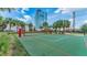 Outdoor paddle ball court with green surface and red lines at 1208 E Kennedy Blvd # 410, Tampa, FL 33602