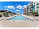 Resort-style pool with ample deck space and cabanas at 1208 E Kennedy Blvd # 410, Tampa, FL 33602