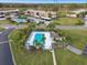 Aerial view of community pool and surrounding buildings at 130 Lakeview Way # 130, Oldsmar, FL 34677