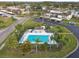 Community pool and surrounding buildings from above at 130 Lakeview Way # 130, Oldsmar, FL 34677