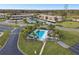 Aerial view showing community pool and building at 130 Lakeview Way # 130, Oldsmar, FL 34677