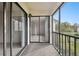 Spacious balcony with sliding glass doors leading to the interior at 130 Lakeview Way # 130, Oldsmar, FL 34677