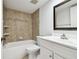 Clean bathroom with updated tile and vanity at 130 Lakeview Way # 130, Oldsmar, FL 34677
