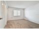 Spacious bedroom with neutral walls and carpeting at 130 Lakeview Way # 130, Oldsmar, FL 34677