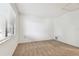 Bedroom with window, closet, and access to another room at 130 Lakeview Way # 130, Oldsmar, FL 34677