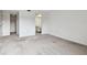 Spacious bedroom with neutral carpeting and bathroom access at 130 Lakeview Way # 130, Oldsmar, FL 34677