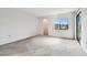 Bright bedroom with carpet flooring and a walk-in closet at 130 Lakeview Way # 130, Oldsmar, FL 34677