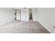Spacious bedroom with neutral carpeting and ample closet space at 130 Lakeview Way # 130, Oldsmar, FL 34677