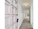 Bright entryway with light colored walls and carpeting, leading to the living area at 130 Lakeview Way # 130, Oldsmar, FL 34677