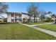 Condo building exterior with walkway and landscaping at 130 Lakeview Way # 130, Oldsmar, FL 34677