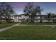 Two-story building with lush landscaping and walkway at 130 Lakeview Way # 130, Oldsmar, FL 34677