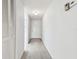 Bright hallway with neutral carpeting and closet at 130 Lakeview Way # 130, Oldsmar, FL 34677
