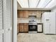 Kitchen features stainless steel appliances and wood cabinets at 130 Lakeview Way # 130, Oldsmar, FL 34677
