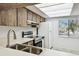 Updated kitchen with stainless steel appliances and wood cabinets at 130 Lakeview Way # 130, Oldsmar, FL 34677
