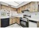 L-shaped kitchen with stainless steel appliances at 130 Lakeview Way # 130, Oldsmar, FL 34677