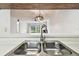 Kitchen sink overlooking the living room at 130 Lakeview Way # 130, Oldsmar, FL 34677