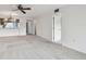 Open living room with carpeted floors and ceiling fan at 130 Lakeview Way # 130, Oldsmar, FL 34677