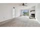 Spacious living room with fireplace and sliding doors at 130 Lakeview Way # 130, Oldsmar, FL 34677