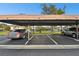 Covered parking area with designated spaces for residents at 130 Lakeview Way # 130, Oldsmar, FL 34677