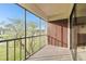 Spacious screened balcony overlooks a lush green landscape at 130 Lakeview Way # 130, Oldsmar, FL 34677