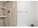 Updated shower with beige tile and built-in shelving at 130 Lakeview Way # 130, Oldsmar, FL 34677