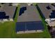 Aerial view of house featuring solar panels and patio at 13230 Wildflower Meadow Dr, Riverview, FL 33579