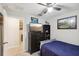 Bedroom with TV, dresser, and full-size bed at 13230 Wildflower Meadow Dr, Riverview, FL 33579