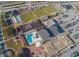 Aerial view of community amenities including pool, tennis courts, and clubhouse at 1354 Emerald Dunes Dr, Sun City Center, FL 33573