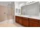 Bathroom with double vanity and large walk-in shower at 1354 Emerald Dunes Dr, Sun City Center, FL 33573