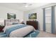Main bedroom with a dresser and plenty of natural light at 1354 Emerald Dunes Dr, Sun City Center, FL 33573