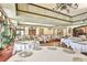 Elegant dining room with round tables and a high ceiling at 1354 Emerald Dunes Dr, Sun City Center, FL 33573