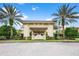 Elegant community entrance featuring a grand archway at 1354 Emerald Dunes Dr, Sun City Center, FL 33573