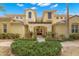 Front view of a two-story home with walkway at 1354 Emerald Dunes Dr, Sun City Center, FL 33573