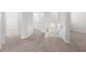 Upstairs hallway with carpeted floors and access to bedrooms at 1354 Emerald Dunes Dr, Sun City Center, FL 33573