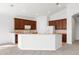 Modern kitchen with wood cabinets and breakfast bar at 1354 Emerald Dunes Dr, Sun City Center, FL 33573