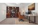 Home office with built-in shelving and a large desk at 1354 Emerald Dunes Dr, Sun City Center, FL 33573