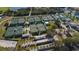 Aerial view showing multiple well-maintained tennis courts at 1354 Emerald Dunes Dr, Sun City Center, FL 33573