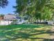 Large grassy backyard with white fence at 1503 Limona Rd, Brandon, FL 33510