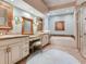 Large bathroom with double vanity, soaking tub, and walk-in shower at 1503 Limona Rd, Brandon, FL 33510