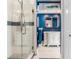 Modern bathroom with a glass shower, white vanity, and blue walls at 1503 Limona Rd, Brandon, FL 33510