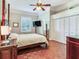 Spacious bedroom with a wooden bed, hardwood floors, and built-in closets at 1503 Limona Rd, Brandon, FL 33510